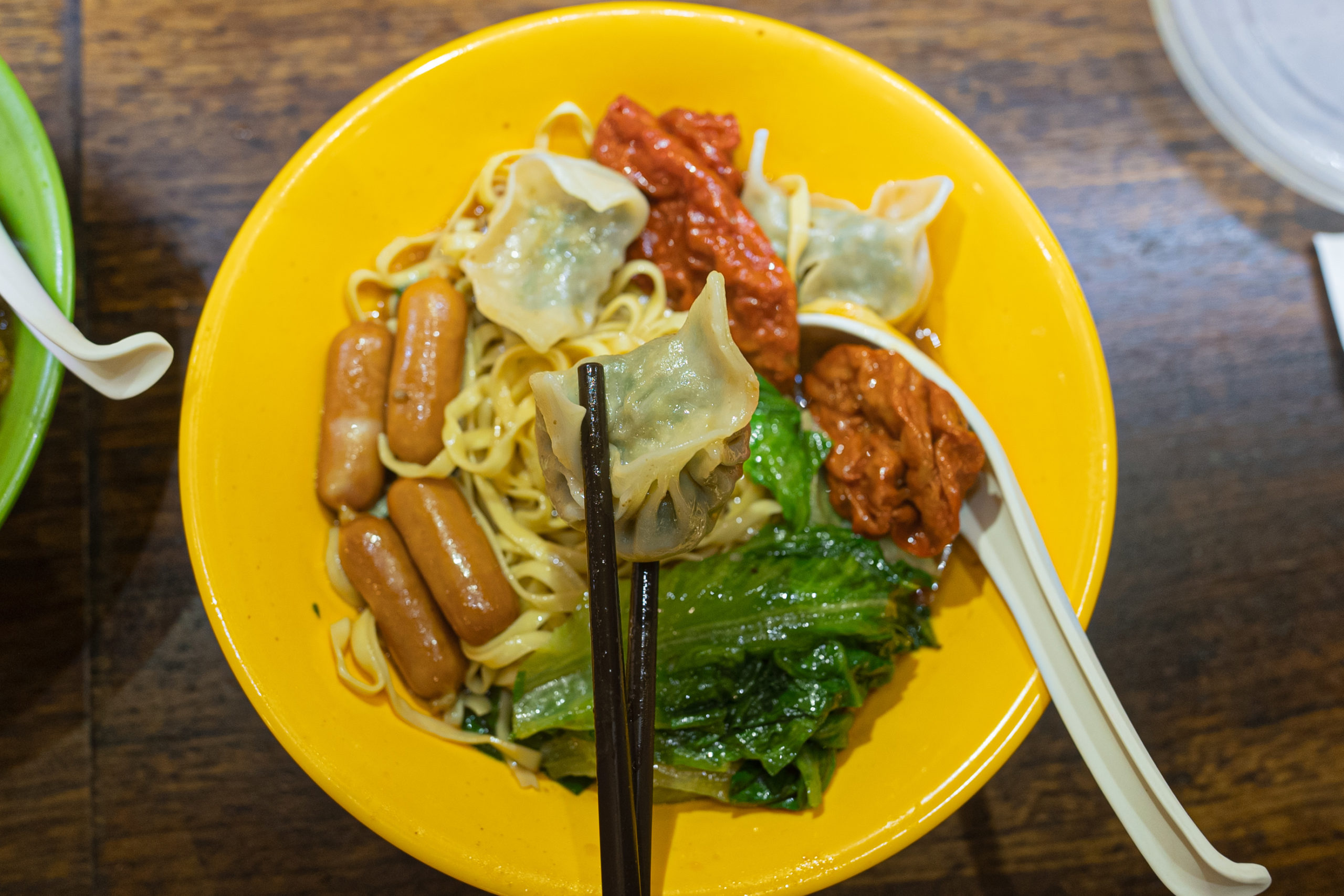 Our choice is thick noodles with dumplings, sausages, vegetables, sour wheat gluten. How about yours?